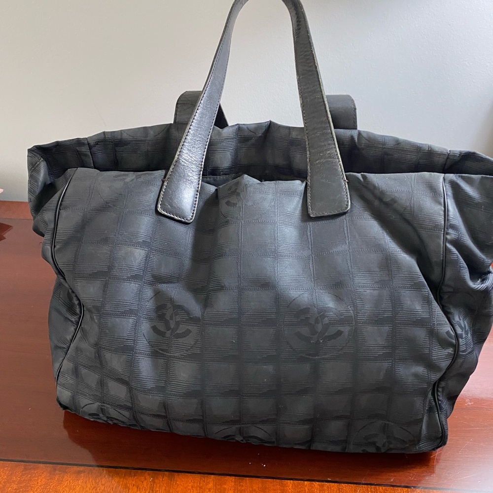 Authentic Chanel tote with leather straps